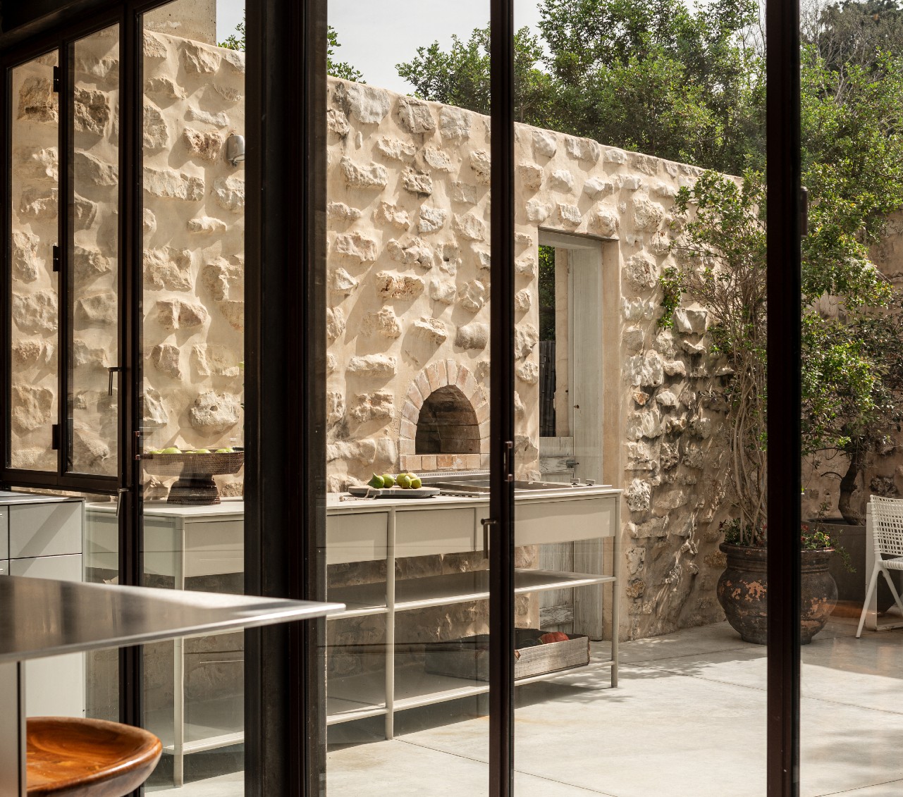 CSL stainless counter against a stone wall