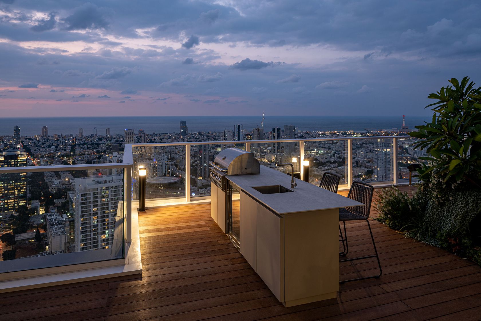 UNICA outdoor kitchen on a Toronto-style rooftop in the evening