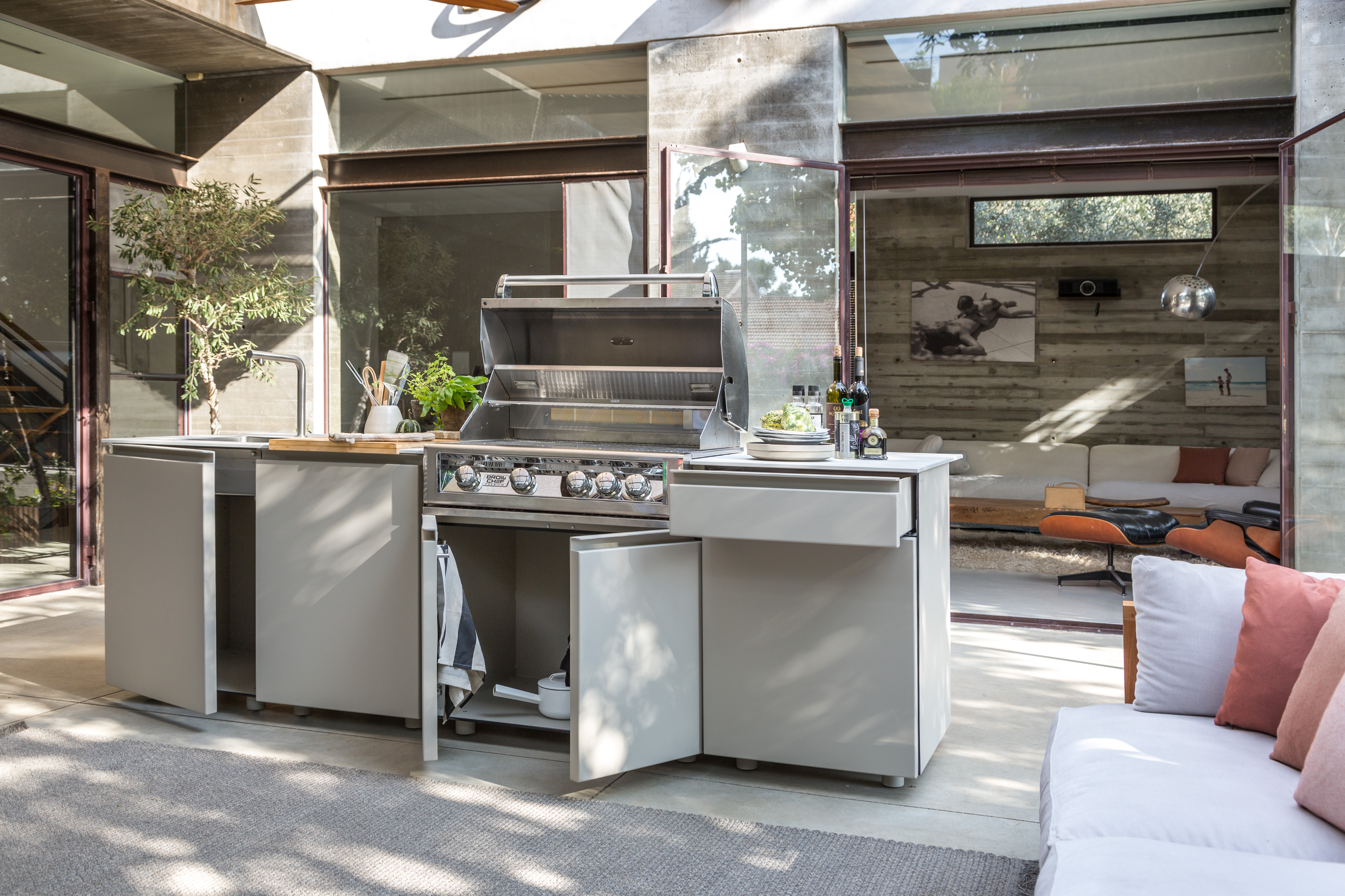 UNICA stainless kitchen with grill hood open and prep cart